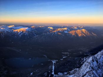 Scenic view of dramatic landscape against sky during sunset