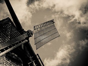 Low angle view of building against cloudy sky