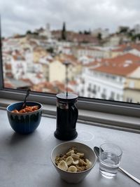 Close-up of drink served on table against building