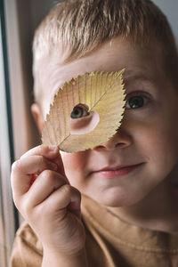 Close-up portrait of boy holding ice cream