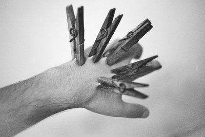 High angle view of human hand with clothespin