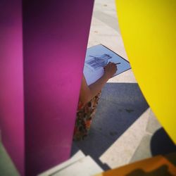 Low section of woman standing on tiled floor