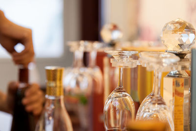 Close-up of wine glasses on table