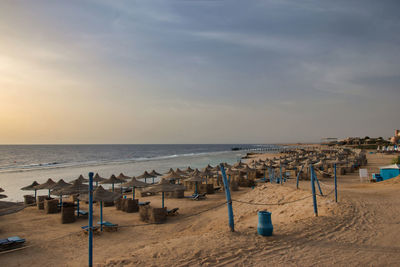 Scenic view of beach against sky during sunset