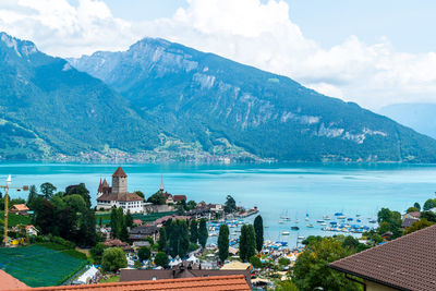 Panoramic view of buildings and mountains against sky