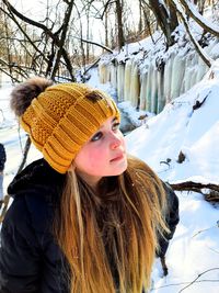 Portrait of young woman looking away