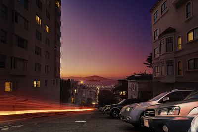 View of city street at sunset