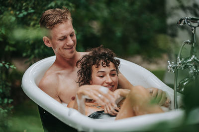 Portrait of shirtless man and woman