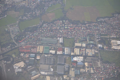 High angle view of city lit up at night
