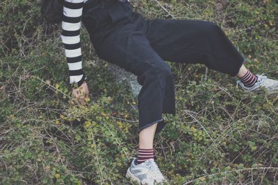 Low section of woman on grass