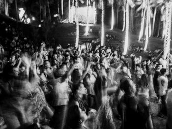 Crowd on street in city at night