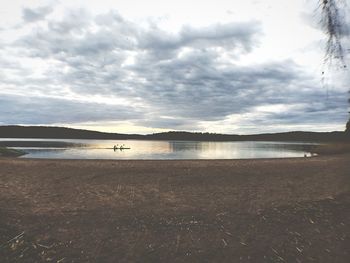 Scenic view of sea against cloudy sky