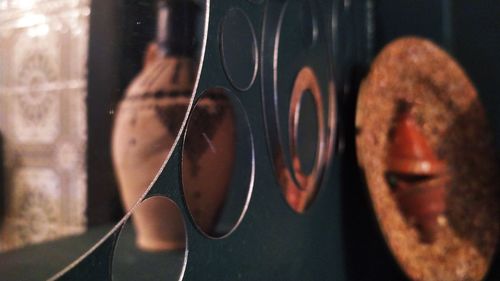 Close-up of shoes hanging on metal