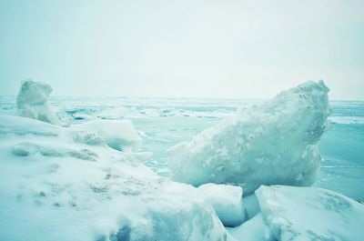 Scenic view of sea against clear sky during winter