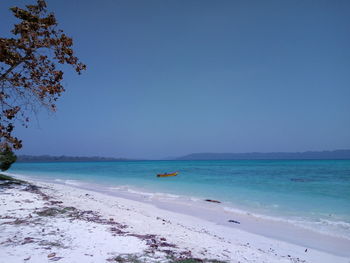 Scenic view of sea against clear blue sky