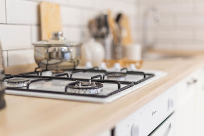 Close up of gas stove bright kitchen in scandinavian style