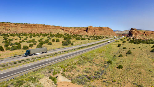 Scenic view of land against clear blue sky