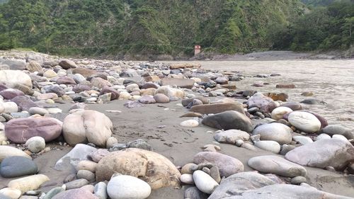 Stones on rocks by river