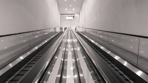 Low angle view of illuminated escalator