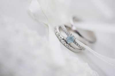 Close-up of wedding rings with textile