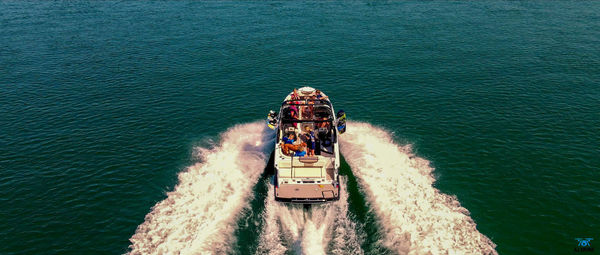 High angle view of people on boat in sea