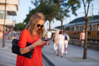 Young woman using mobile phone