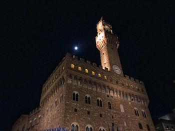 Low angle view of historical building at night