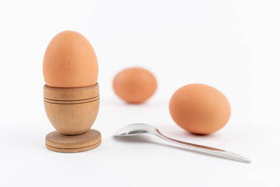 Close-up of egg against white background