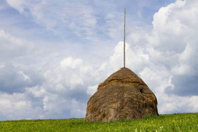 Scenic view of farm against sky