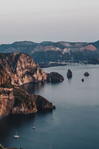 Scenic view of sea and rocks against sky