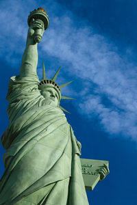 Low angle view of statue against cloudy sky