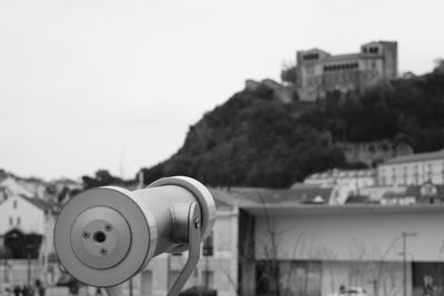 Close-up of coin-operated binoculars against clear sky