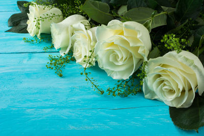 Close-up of yellow roses on table