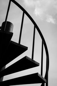 Low angle view of metal against sky