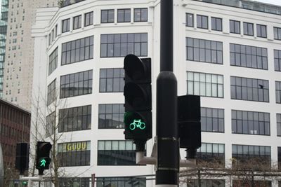 Road sign against buildings in eindhoven centrum