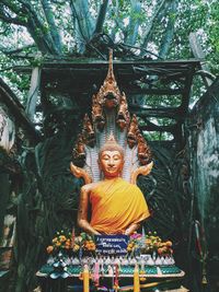 Buddha statue in temple outside building