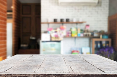 Close-up of chairs on table against building