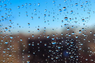 Full frame shot of wet glass window