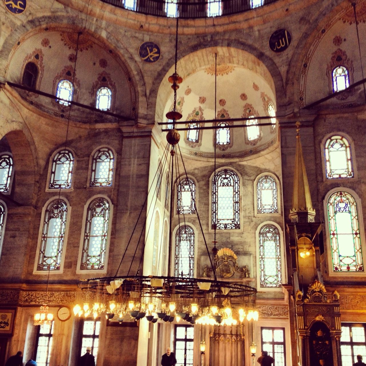 religion, place of worship, spirituality, church, arch, indoors, architecture, low angle view, built structure, cathedral, ornate, window, ceiling, illuminated, no people, hanging, architectural column, interior