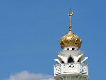 Low angle view of building against blue sky