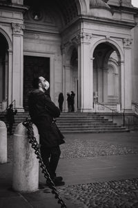 Rear view of woman walking on street