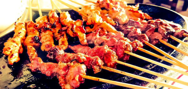 Close-up of meat on barbecue grill