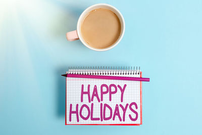 Close-up of coffee on table against blue background