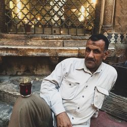 Portrait of man sitting at home