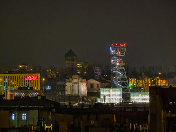 Illuminated buildings in city at night