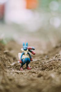 Close-up of stuffed toy on field