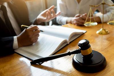 Close-up of woman hand on table
