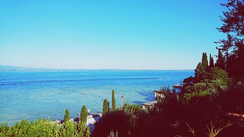 Scenic view of sea against clear blue sky