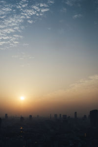 Cityscape against sky during sunset