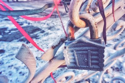Close-up of padlocks hanging on metal
